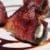 Bacon Wrapped Figs Stuffed with Goat Cheese and topped with a Balsamic Reduction